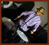 Dholi TK playing drums at a party